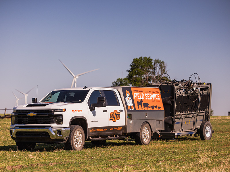 The OSU Food Animal ambulatory truck is pulling a mobile squeeze chute
